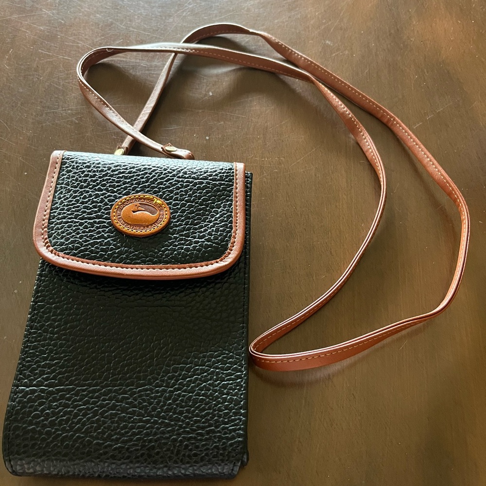 Dooney & Bourke Black and Brown Crossbody Bag.
I am not sure if a true Dooney.